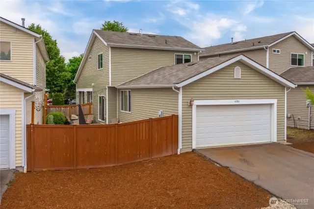 Back alley access to garage and driveway parking. Gate access to fenced yard.