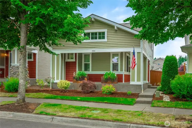Concrete porch wraps around the full front of house and side all the way to the fenced yard.