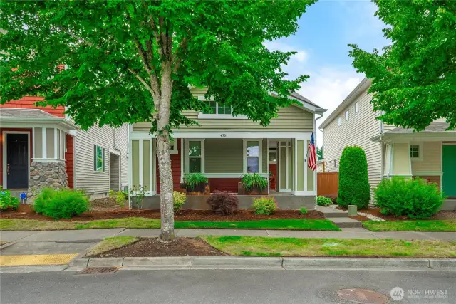 Concrete porch wraps around the full front of house and side all the way to the fenced yard.