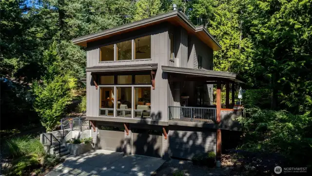 Covered deck featuring outdoor gas fireplace. Perfect for entertaining!
