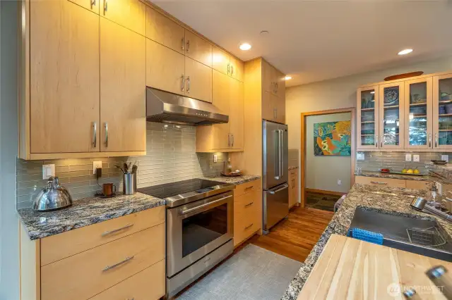 Chef's kitchen with Wolf cooktop / oven.