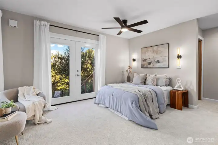 Lowest level bedroom #6; also acts a primary for the ADU with doors to a deck
