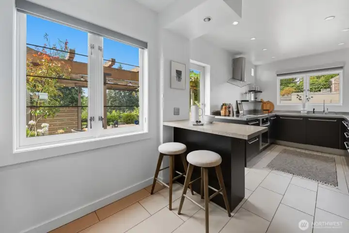 Kitchen has a lovely breakfast bar to enjoy your morning coffee or host friends while you cook.