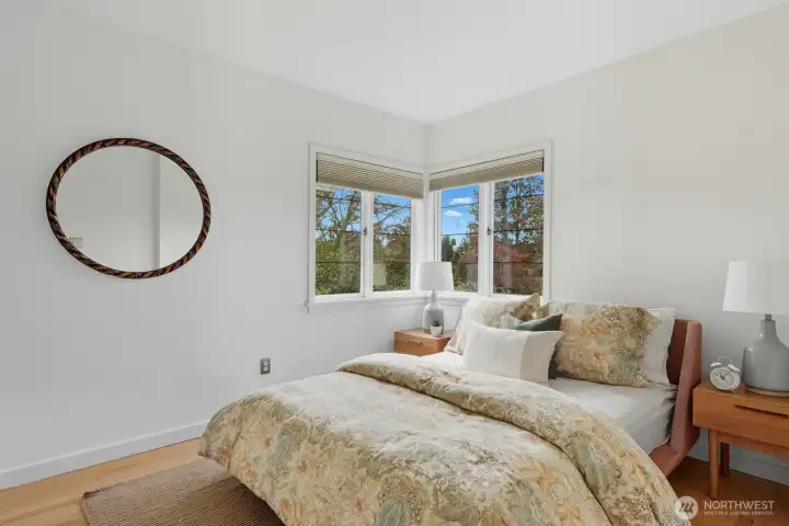 Bedroom one on the main level. Views from the window of Lake Washington.