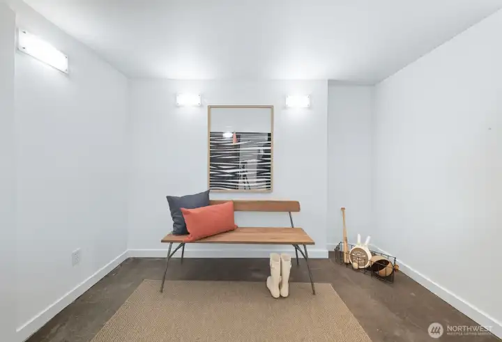 Mudroom off the garage is the perfect place to store coats and shoes.