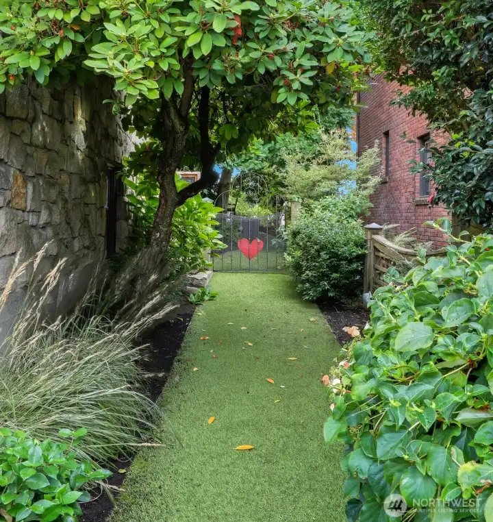 Fully fenced and a lovely side path along the south side of the home.