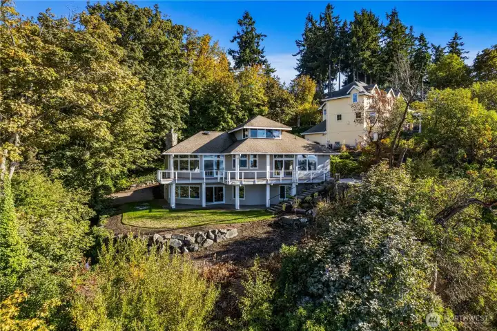 Welcome to this private and serene waterfront home located in NE Tacoma on over 3/4 of an acre.