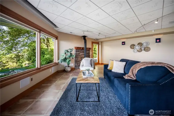 Downstairs living space overlooks the backyard and view