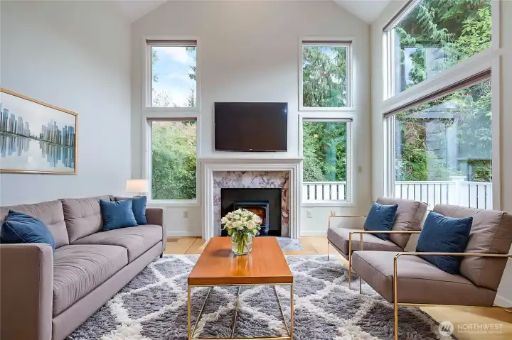 The living room with virtual staging shows one of many ways to decorate this warm and inviting home.