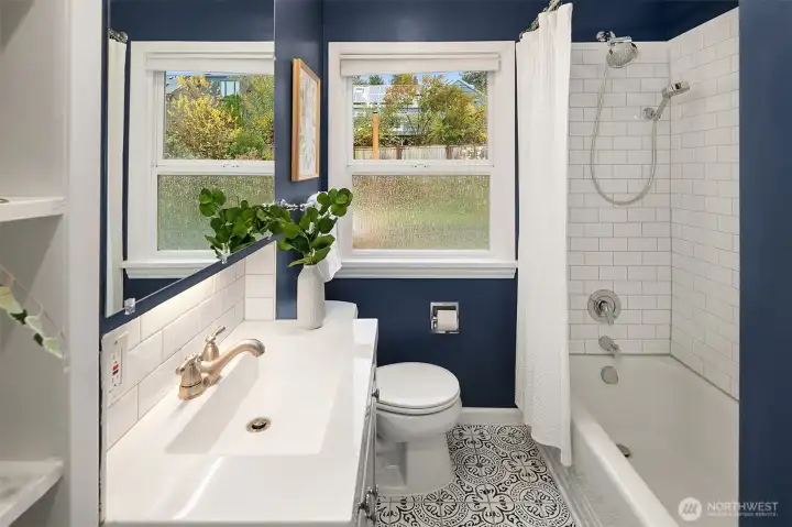 Adorable main floor full bathroom with recessed lighting over sink
