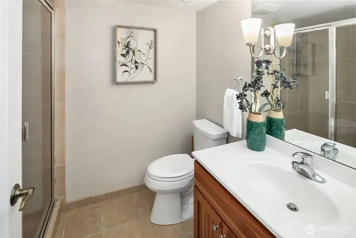 The 3/4 bath on the lower level has a generous walk-in shower.
