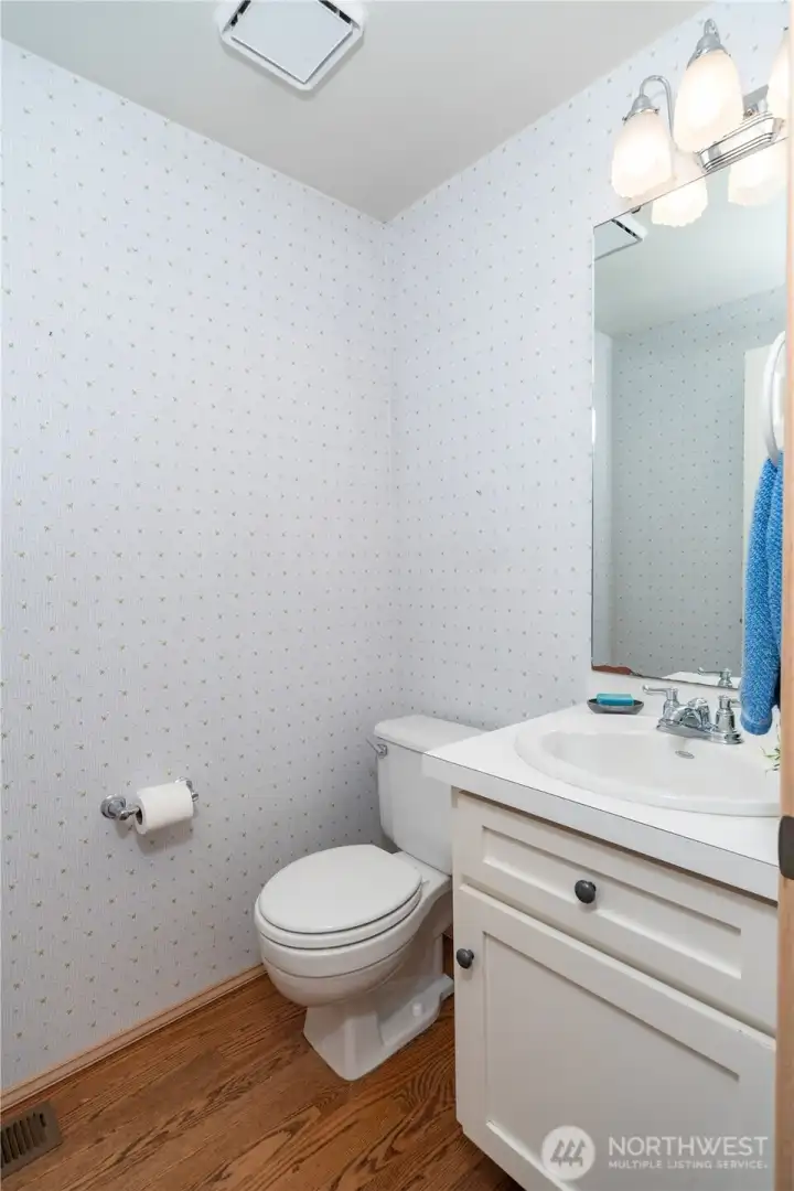 Half bath with easy access to the garage, kitchen and mudroom.