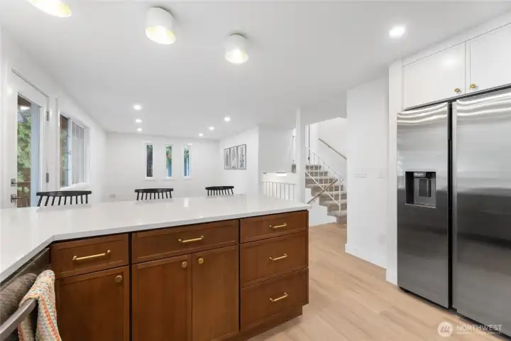 Bright white quartz countertops under new over-counter lighting.