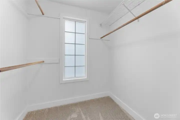 Convenient walk-in closet in primary suite.