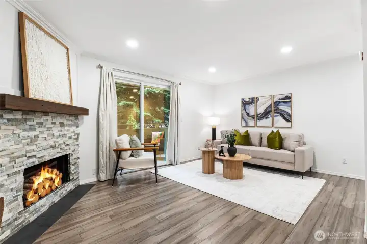 Open living room w/ wood burning FP