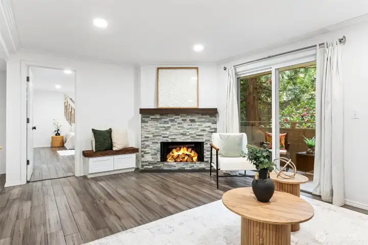 Open living room w/ wood burning FP