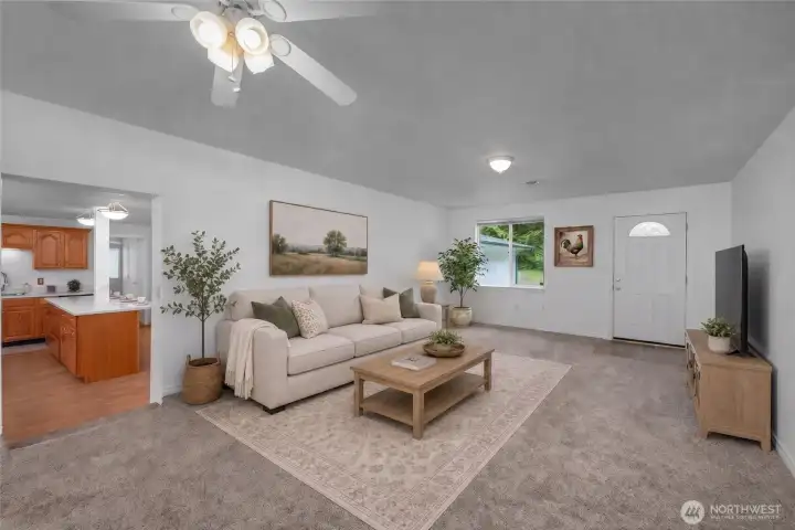 Virtually staged living room looking to the front entry.