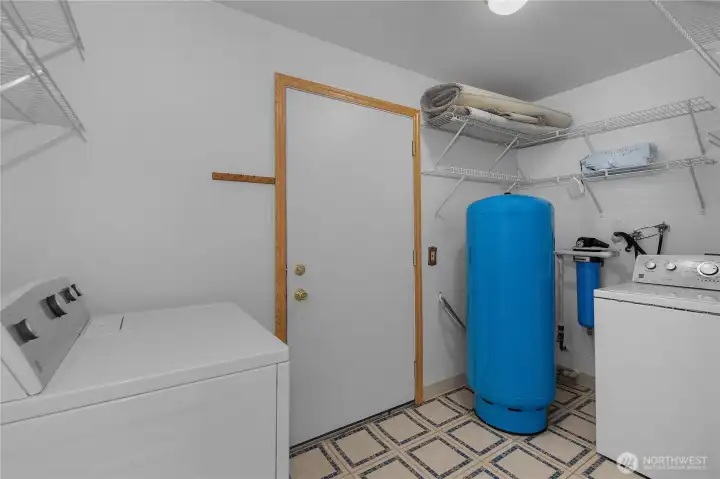 Laundry mudroom adjacent to two car attached garage