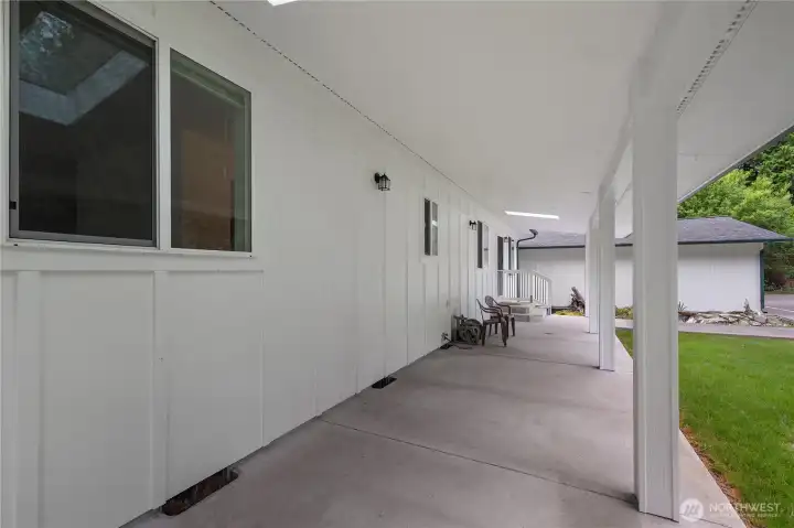 Dreamy and deep covered front patio. Bring your hanging baskets and rockers!