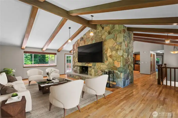 Upstairs living room with working fireplace virtually staged.