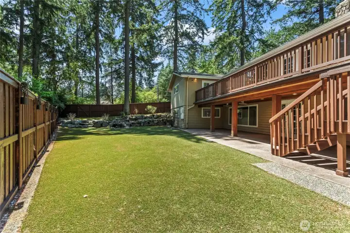 View of the back of the House.Fully Fenced.Turf back yard and soothing Water feature