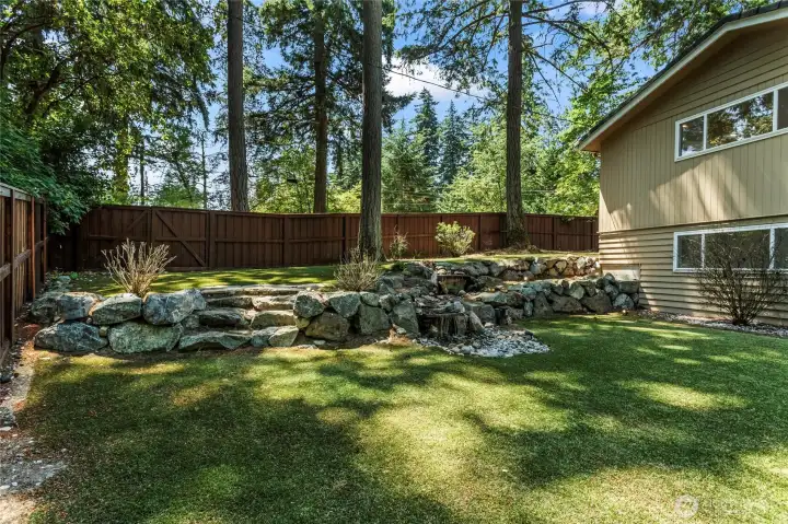 View of Water Feature and steps leading up to the side of the house.