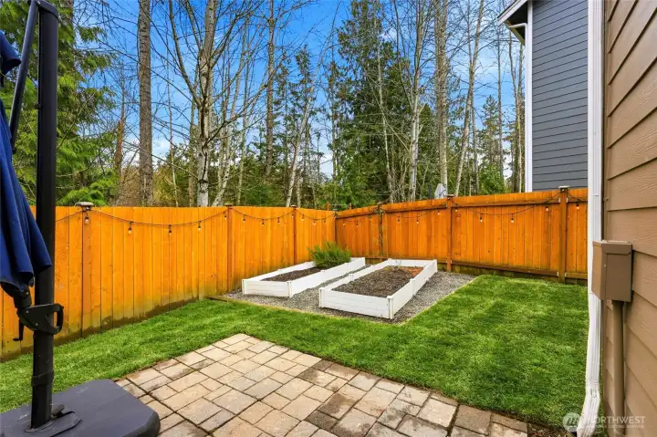 The yard had brand new grass as well as raised garden beds. The yard had brand new grass as well as raised garden beds.