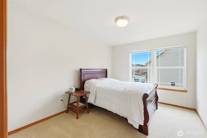 Second bedroom. Upstairs has three additional bedrooms, each with oversized closets. Second bedroom. Upstairs has three additional bedrooms, each with oversized closets.