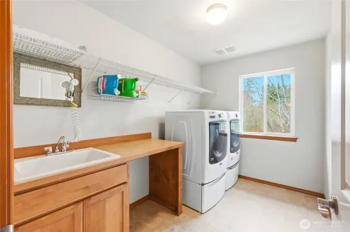 Upstairs laundry room and folding space. Upstairs laundry room and folding space.