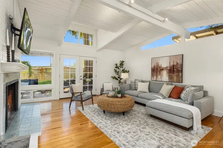 Vaulted ceilings, walls of glass, and abundant natural light create a bright, airy living space designed for effortless everyday living and seamless indoor-outdoor connection.