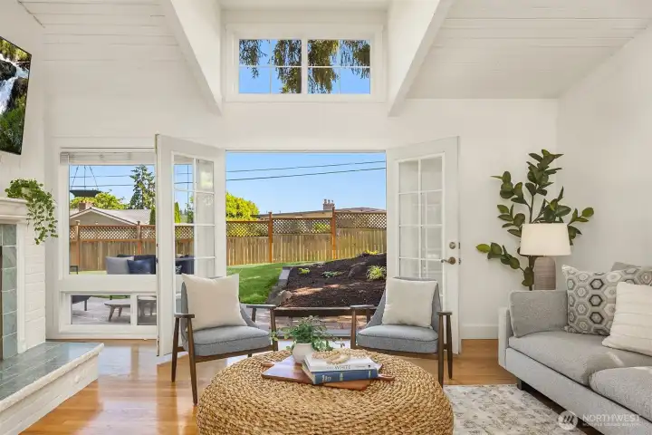 French doors open effortlessly to the sun-filled patio and fully fenced backyard, creating an easy indoor-outdoor flow ideal for summer dining, entertaining, or quiet mornings surrounded by greenery.