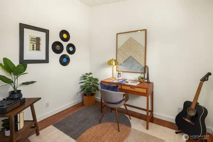 A flexible den just off the dining room offers the perfect space for a home office, creative studio, music room, or quiet reading retreat.