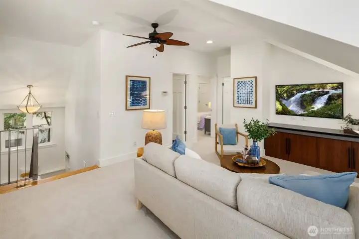 The expansive upper-level bonus room offers exceptional flexibility with space for media, lounging, work-from-home needs, or play — all beneath vaulted ceilings and filled with natural light.