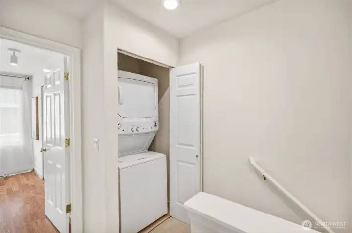 At the top of the upper level, find the in-unit laundry.
