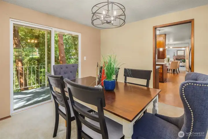 Dining room with slider to deck. Dining room with slider to deck.