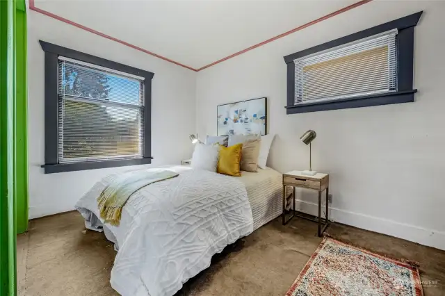 Primary bedroom on the main floor with two closets and shared adjoining bathroom.