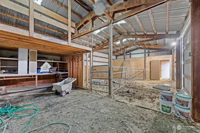 Looking across the stable area toward the workshop end of the shop.