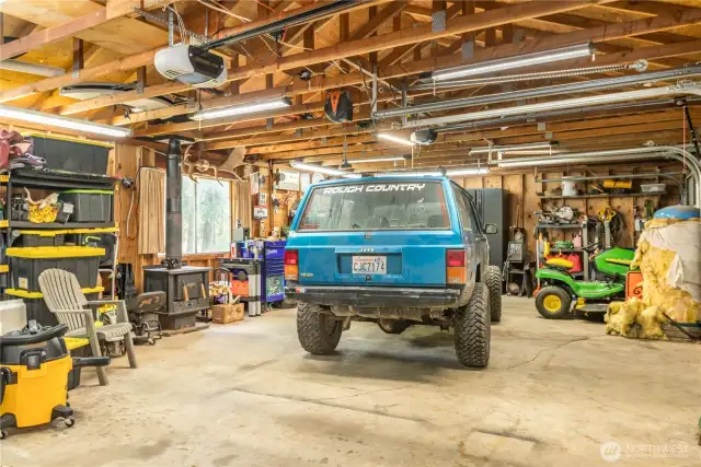 Large garage with wood stove.