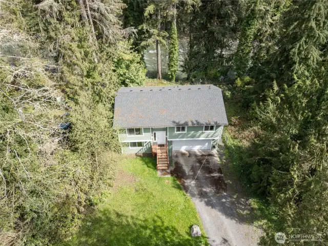 Look at THIS home AND lot with high-bank river frontage. Brand-spanking new roof ! THAT is an expense you won't have to worry about for many years to come.