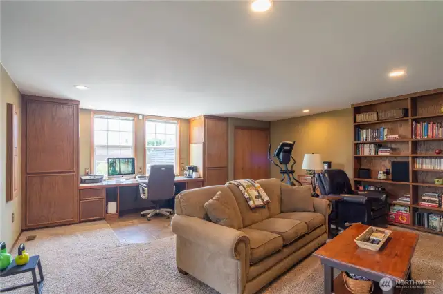 Bonus room with built in desk, book shelves and entertainment area.