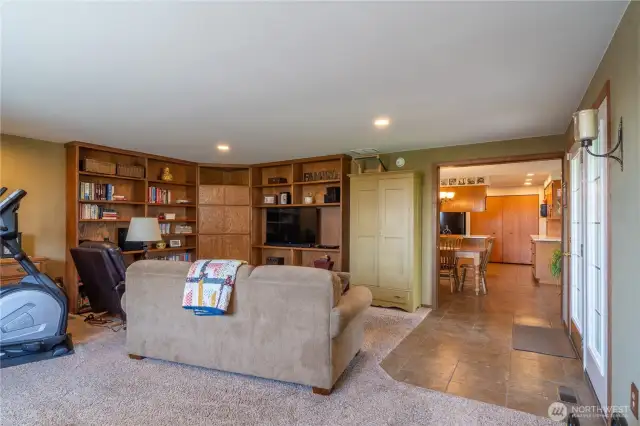 Bonus room with built in desk, book shelves and entertainment area.