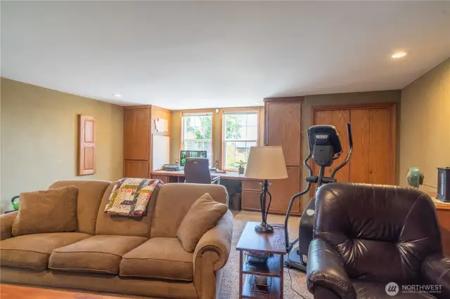Bonus room with built in desk, book shelves and entertainment area.