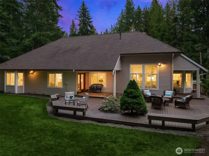 New easy care Timber Tech deck in back yard with multiple entertaining spaces.