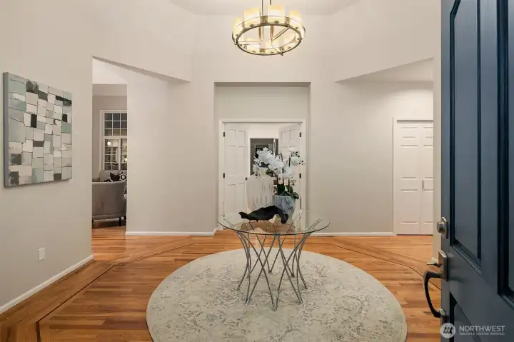Inlaid hardwoods greet you in the entry rotunda.
