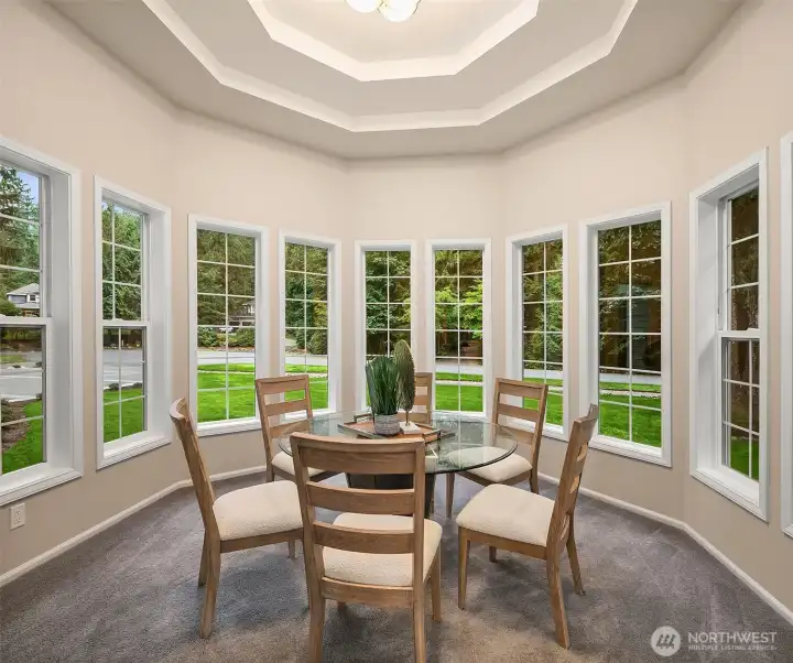 Soaring cantilevered ceiling in formal dining room.