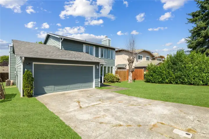 long driveway and 2-car garage