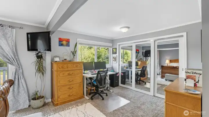 This generous bedroom offers space for both rest and a private lounge.