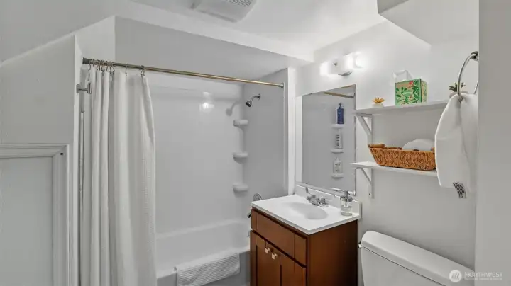 Full bath conveniently located off the downstairs studio room.