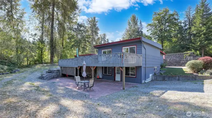 Spacious two-level deck and patio extend your living outdoors.
