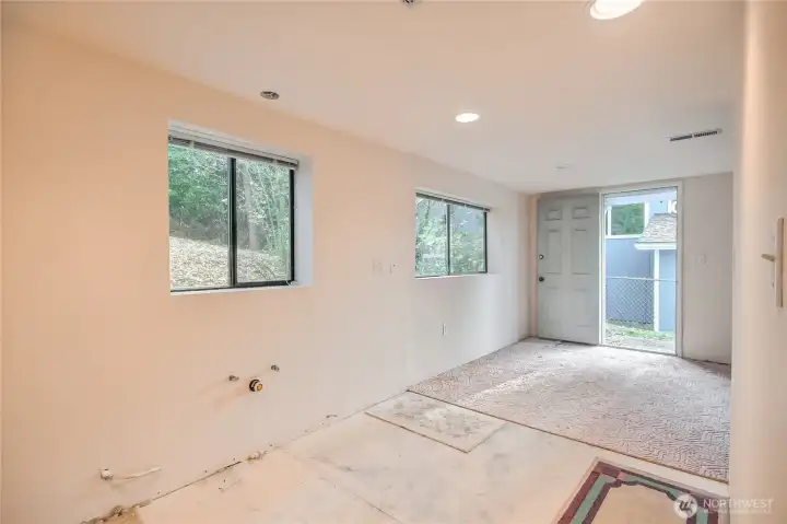 Plumbing and electrical for kitchen on wall